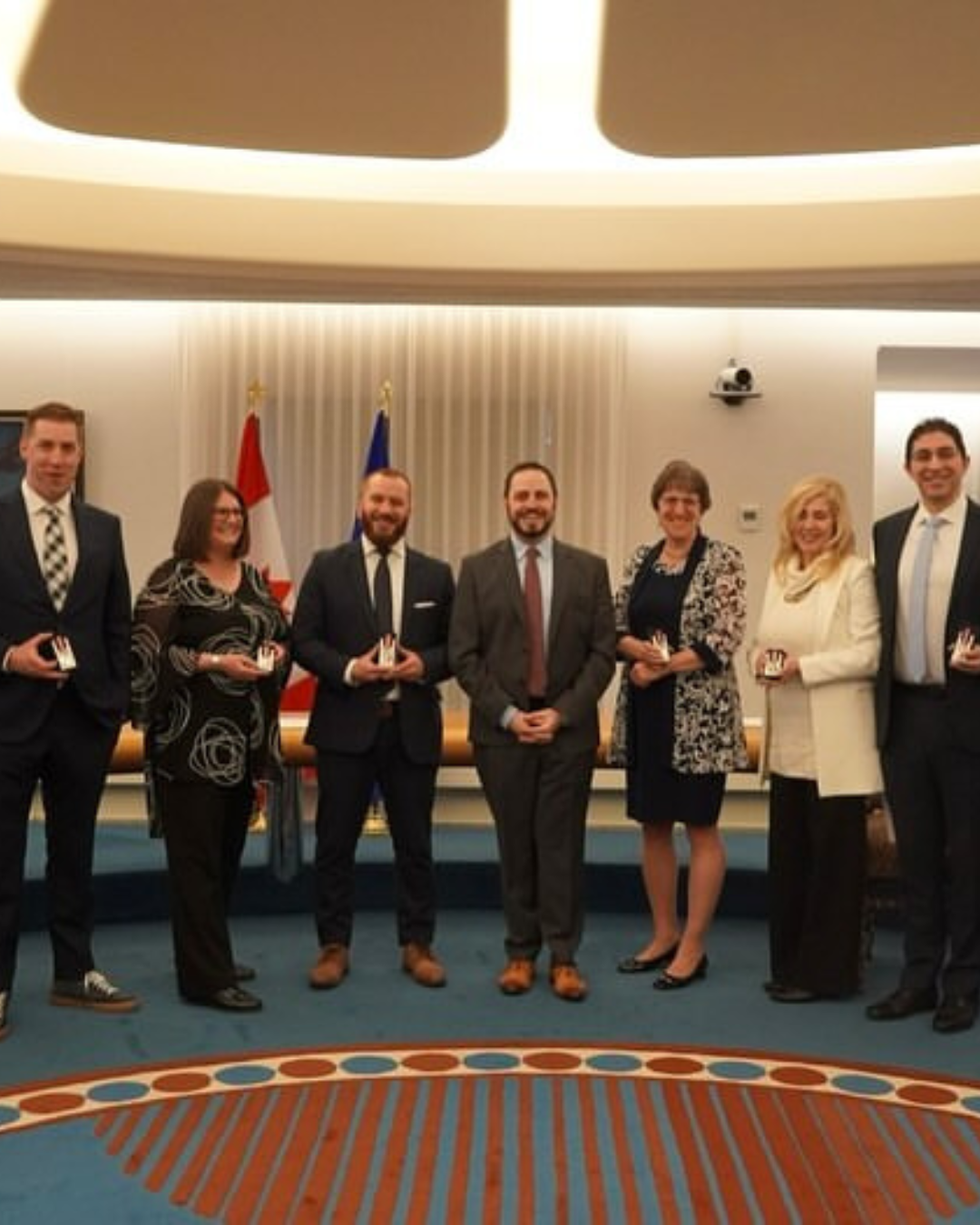 Trustee Palazzo posing in a group with Minister of Education with King Charles III’s Coronation Medal