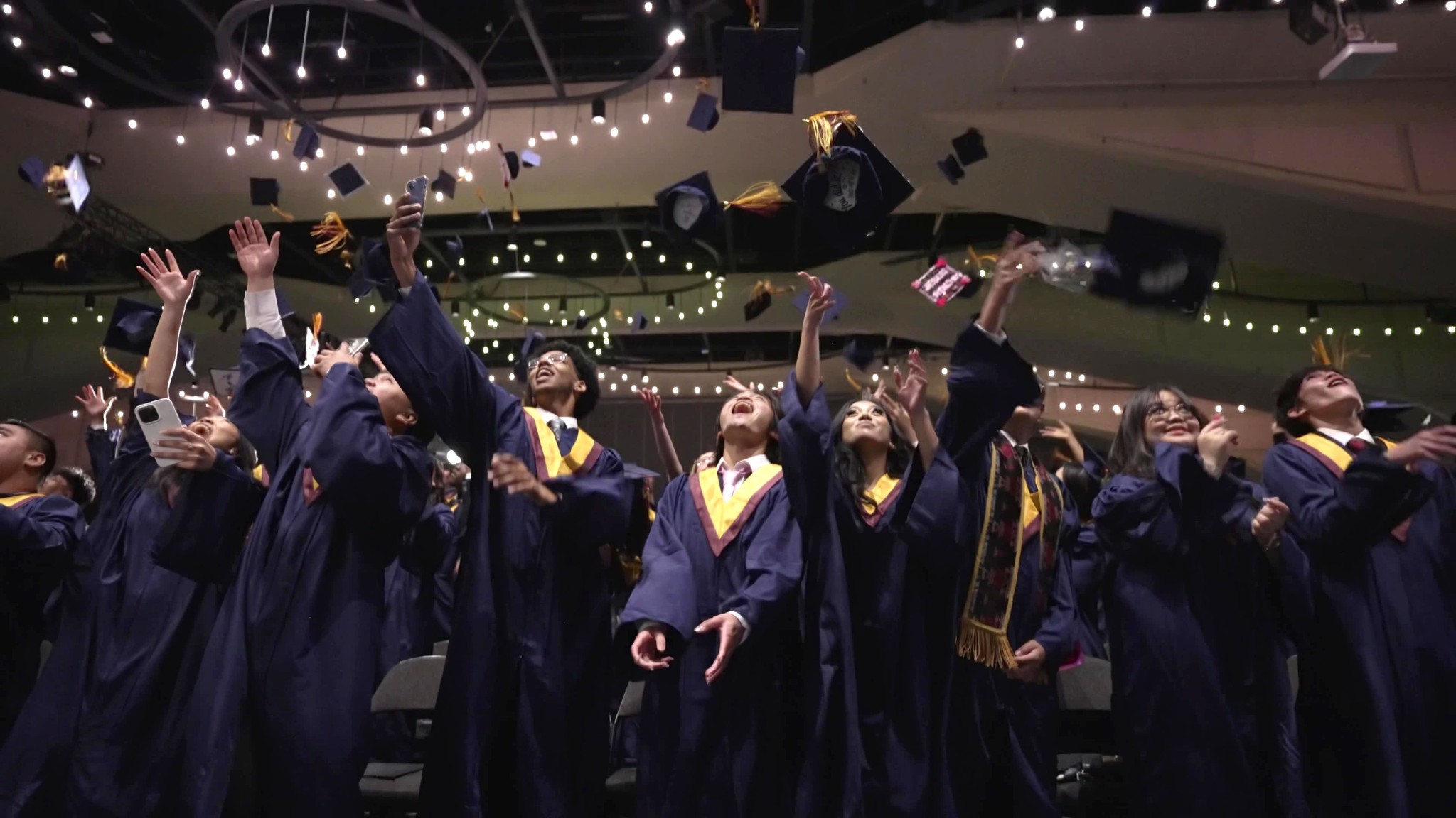 graduation hats in the air