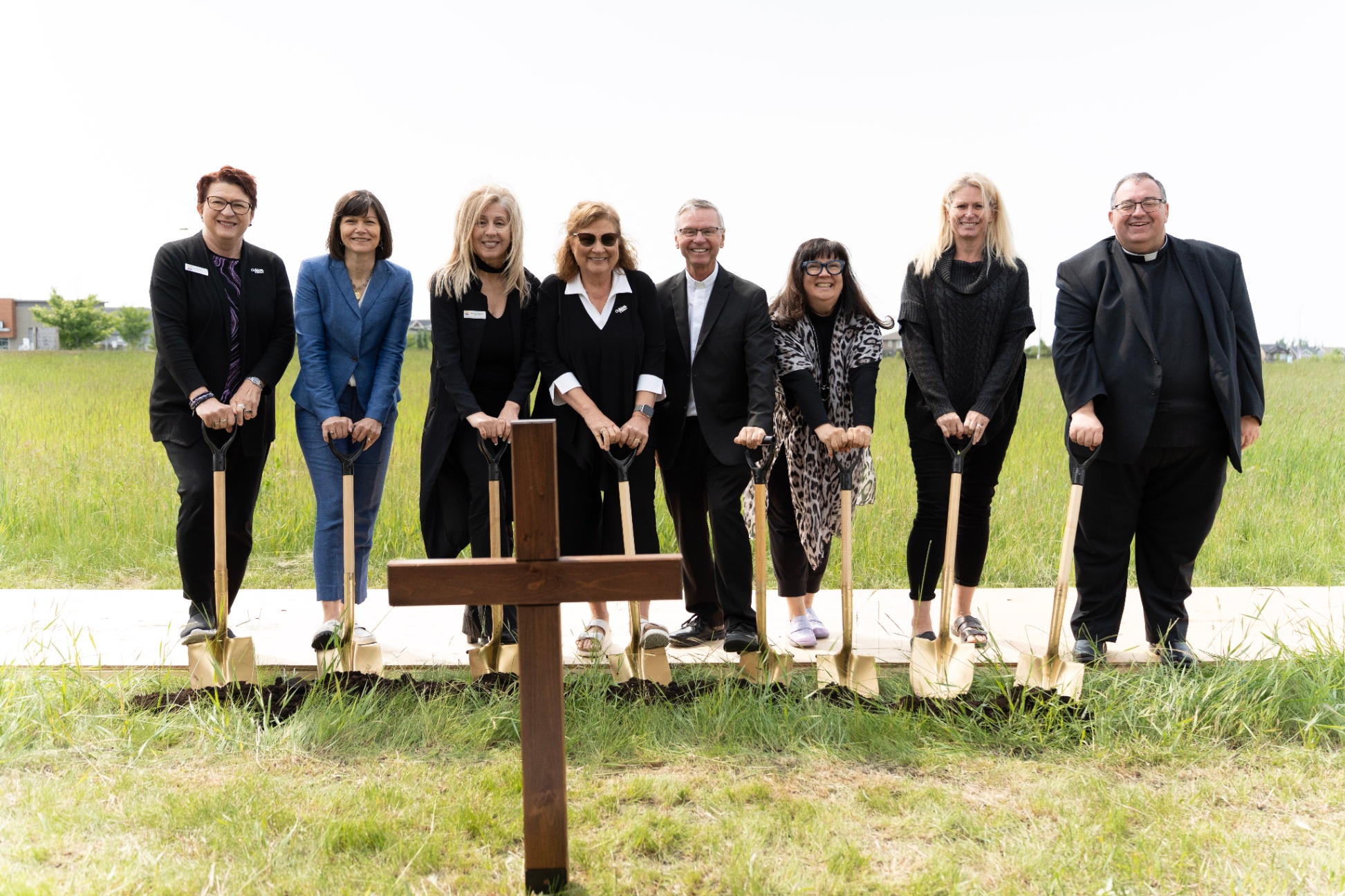ECSD Board of Trustees, Chief Superintendent, Bishop Motiuk and Father Paul gather for a sod turning