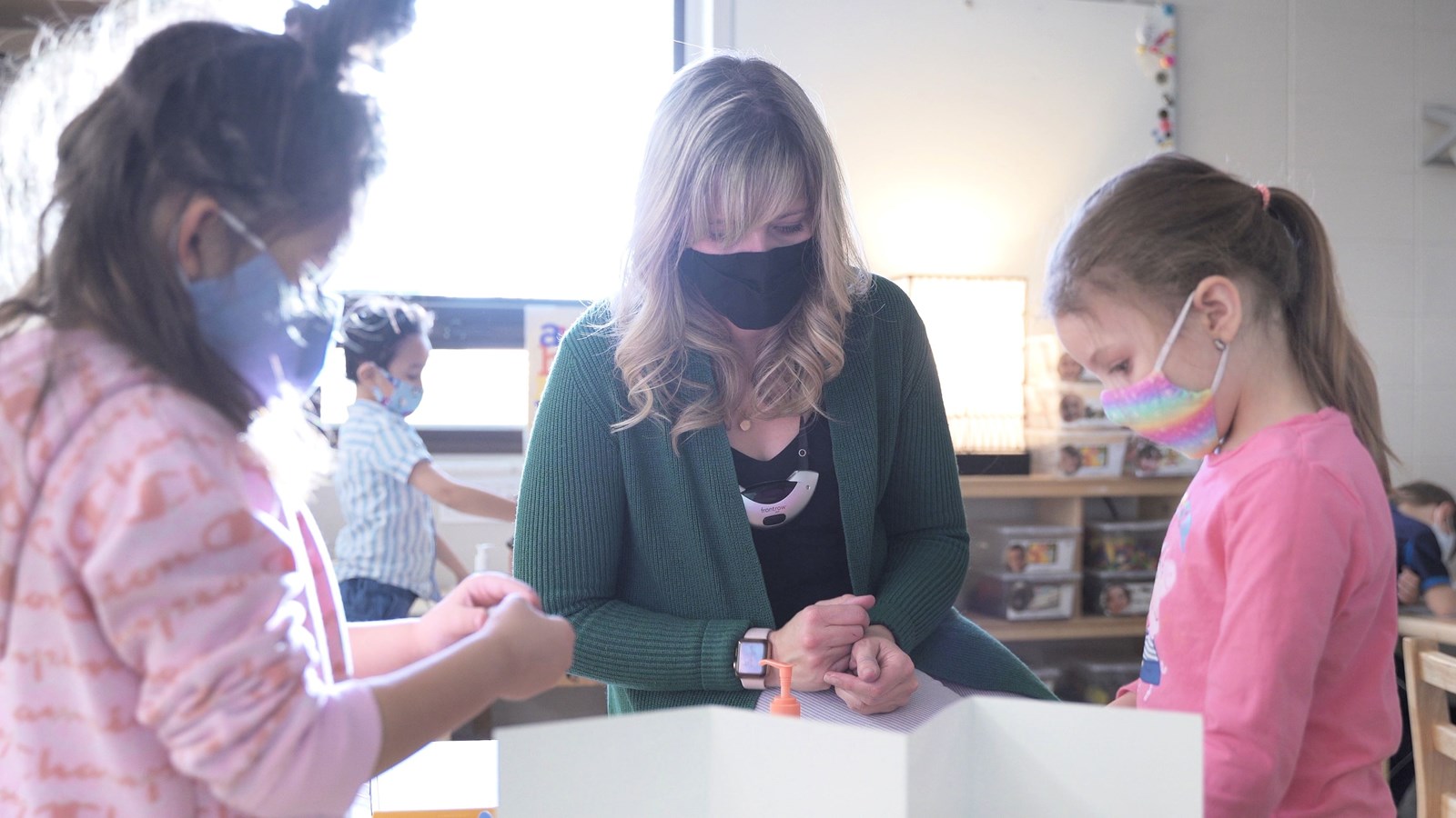 Teacher in classroom with mask