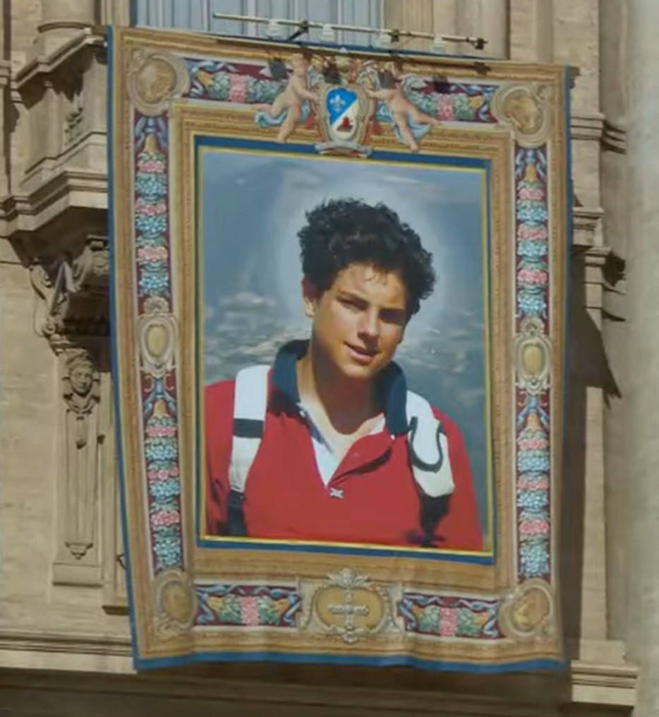 An image of St. Carlo Acutis is displayed at the Vatican for his canonization