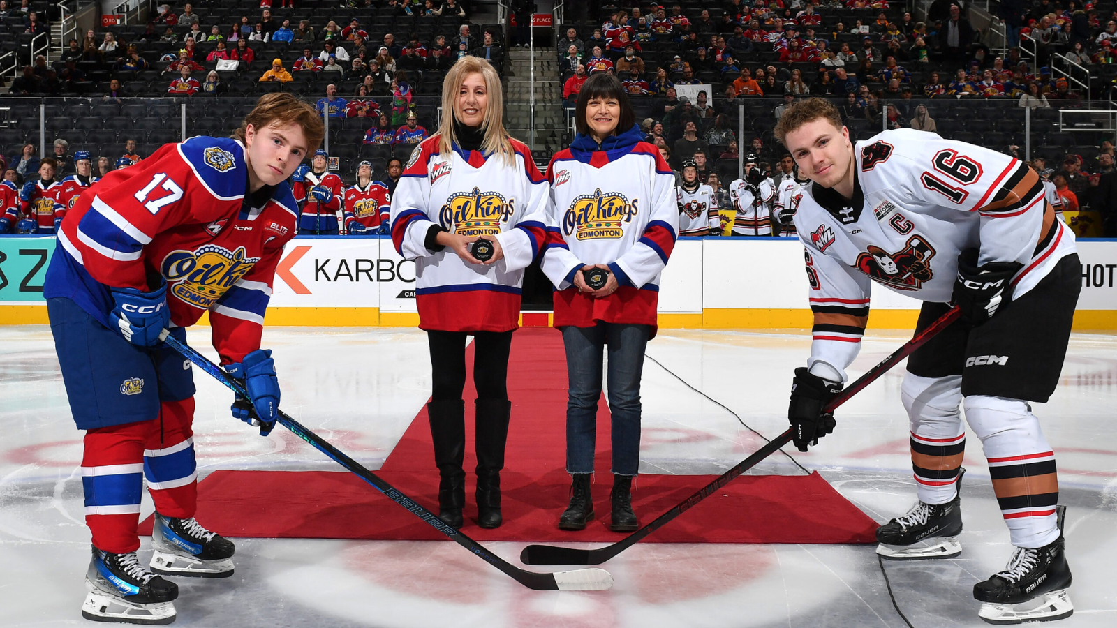 Chair Palazzo and Chief Superintendent Anderson dropping the puck