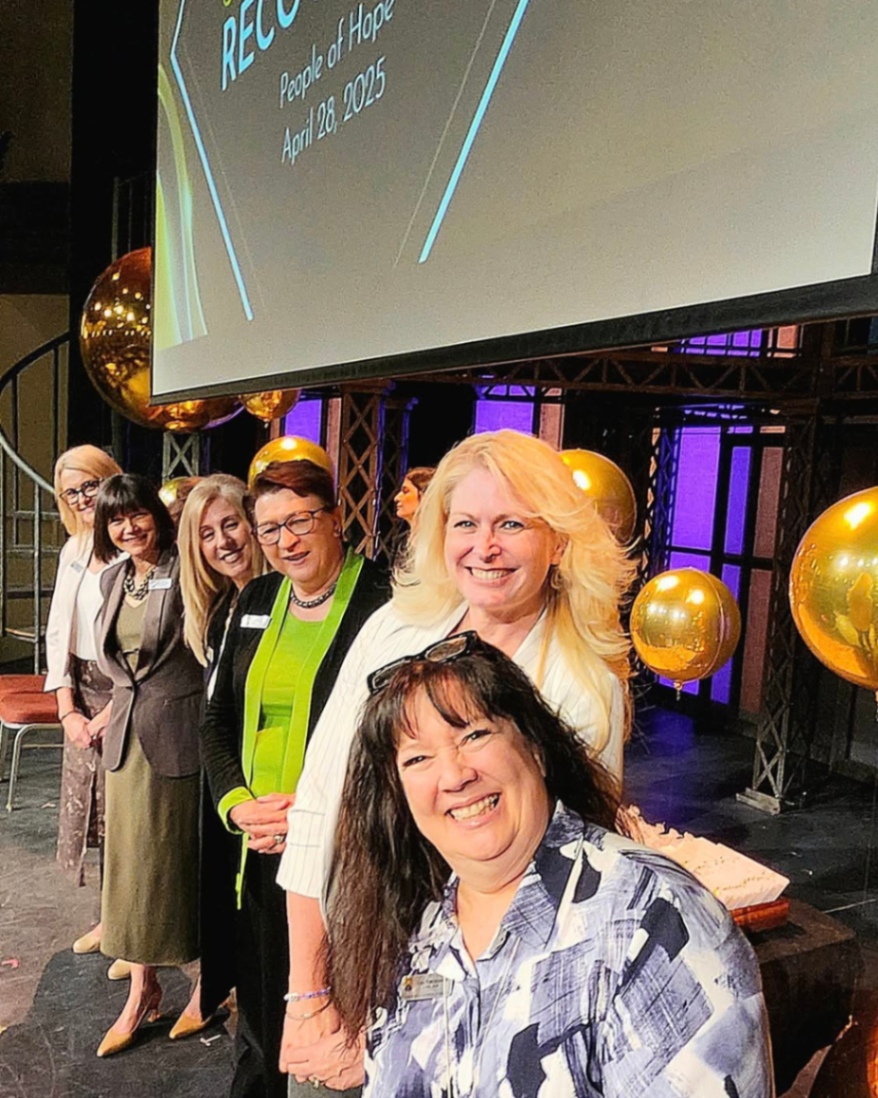 Trustees and Chief Superintendent on stage at the Long Service Awards